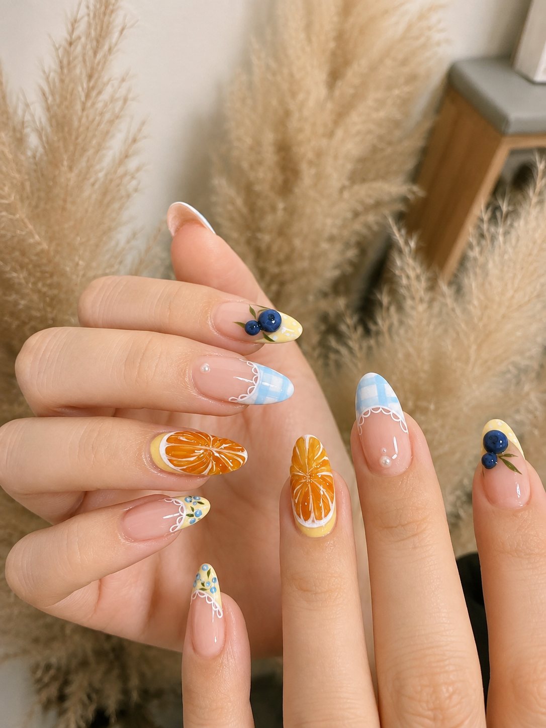 Fruit nail art with orange slices and blueberries